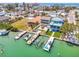 Stunning aerial view of coastal homes with private boat docks on tranquil turquoise waters at 12312 Lagoon Ln, Treasure Island, FL 33706