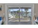 Balcony with sliding glass doors overlooking outdoor scenery at 12312 Lagoon Ln, Treasure Island, FL 33706