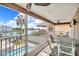 Enjoy waterfront views from this screened balcony with outdoor dining and relaxing seating, a true outdoor escape at 12312 Lagoon Ln, Treasure Island, FL 33706