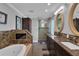 Spacious bathroom with a jetted tub, double vanities, and a glass-enclosed shower, perfect for relaxation at 12312 Lagoon Ln, Treasure Island, FL 33706