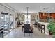 Dining room with water views, modern chandelier, and an adjacent breakfast bar at 12312 Lagoon Ln, Treasure Island, FL 33706