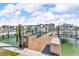 Well-maintained dock with a grilling station, cabinets, and storage, ready for boating and waterfront activities at 12312 Lagoon Ln, Treasure Island, FL 33706
