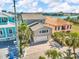 Stunning waterfront home with lush landscaping, paver driveway and attached garage, near the ocean at 12312 Lagoon Ln, Treasure Island, FL 33706