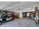 Spacious garage with golf cart, shelving, work bench and ample room for storage and organization at 12312 Lagoon Ln, Treasure Island, FL 33706