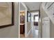 Hallway that leads to a powder room and other rooms of the home at 12312 Lagoon Ln, Treasure Island, FL 33706