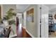 Inviting hallway featuring hardwood floors, neutral walls, and stylish decorations at 12312 Lagoon Ln, Treasure Island, FL 33706