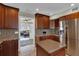 Spacious kitchen with island, stainless steel refrigerator, and access to the living area at 12312 Lagoon Ln, Treasure Island, FL 33706