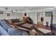 Comfortable living room with sectional sofa, hardwood floors, and modern decor at 12312 Lagoon Ln, Treasure Island, FL 33706