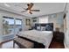 Comfortable bedroom with waterfront views and a private balcony for relaxing outdoors at 12312 Lagoon Ln, Treasure Island, FL 33706