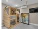 Interior sauna room with a wooden sauna unit, wall-mounted TV and climate control features at 12312 Lagoon Ln, Treasure Island, FL 33706