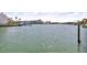Expansive view of the serene waterway, capturing the calm waters and distant shoreline under a bright sky at 12312 Lagoon Ln, Treasure Island, FL 33706