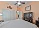 A bedroom with a large closet, white walls, and a wall-mounted television at 1301 Flaxwood Ave, Brandon, FL 33511