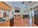 Bright and airy kitchen with tile floors, wooden cabinets, and stainless steel appliances, leading to dining area at 1301 Flaxwood Ave, Brandon, FL 33511