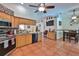 Spacious kitchen featuring tile floors, wooden cabinets, and stainless steel appliances and fixtures at 1301 Flaxwood Ave, Brandon, FL 33511