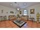 Inviting living room with a chandelier, tile floors, and comfortable seating arrangement at 1301 Flaxwood Ave, Brandon, FL 33511