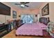 A primary bedroom features a sliding glass door to the backyard and an entertainment center at 1301 Flaxwood Ave, Brandon, FL 33511