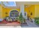 Inviting porch with comfortable seating area, potted plants, and decorative accents for a welcoming atmosphere at 1301 Flaxwood Ave, Brandon, FL 33511