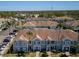 Aerial shot of townhomes showcasing building layout, parking, and green spaces in a well-planned community at 1304 Kelridge Pl, Brandon, FL 33511