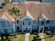 Aerial view of townhome complex showing rooflines, landscaping, and well-kept exteriors at 1304 Kelridge Pl, Brandon, FL 33511