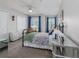 Well-lit bedroom featuring neutral colors, ample closet space, and ceiling fan at 1304 Kelridge Pl, Brandon, FL 33511