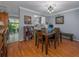 Cozy dining area with hardwood floors, a wooden table, and easy access to the kitchen at 1304 Kelridge Pl, Brandon, FL 33511