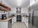 Well-equipped kitchen with stainless steel appliances, granite countertops, and ample cabinet space at 1304 Kelridge Pl, Brandon, FL 33511