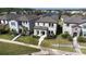 Aerial view of landscaped home, showcasing well-manicured lawn and lush greenery, located in a serene community at 13319 Dorado Shores Ave, Riverview, FL 33579