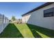 Backyard featuring well-maintained lawn and fenced perimeter, offering privacy and clear property line at 13319 Dorado Shores Ave, Riverview, FL 33579