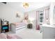 Cozy bedroom with drawers underneath bed, neutral carpet, and lots of natural light at 13319 Dorado Shores Ave, Riverview, FL 33579