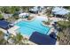 Overhead image showcases a community pool area featuring a lap pool, beach entry, and shaded lounge chairs at 13319 Dorado Shores Ave, Riverview, FL 33579