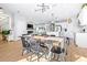 Dining area adjacent to the kitchen, perfect for hosting, featuring hardwood floors and modern decor at 13319 Dorado Shores Ave, Riverview, FL 33579