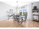Bright and airy dining room with ample natural light, stylish lighting, and inviting ambiance for memorable meals at 13319 Dorado Shores Ave, Riverview, FL 33579