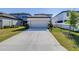 Beautifully landscaped two-story home with a spacious driveway and well-maintained lawn at 13319 Dorado Shores Ave, Riverview, FL 33579