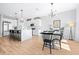 Open kitchen with island seating, perfect for casual dining and entertaining, with a view to the dining area at 13319 Dorado Shores Ave, Riverview, FL 33579