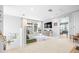 Upstairs loft area featuring windows, tv, seating and neutral decor at 13319 Dorado Shores Ave, Riverview, FL 33579