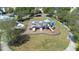 Aerial view of a playground with slides, swings, and climbing structures, set in a well-maintained park area at 13319 Dorado Shores Ave, Riverview, FL 33579