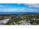 Breathtaking aerial view of a waterfront community with lush greenery, islands, and beautiful ocean at 1345 Springdale St, Clearwater, FL 33755
