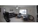 Bright living room features a large window, comfortable seating, and a view into the bedroom at 1345 Springdale St, Clearwater, FL 33755