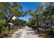 Scenic view of the Pinellas Trail showcasing a crossing arm, landscaping, and sunny recreational path at 1345 Springdale St, Clearwater, FL 33755