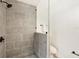 Modern bathroom with tiled shower and glass partition at 1410 San Charles Dr, Dunedin, FL 34698