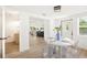 Bright dining room with open concept to the kitchen at 1410 San Charles Dr, Dunedin, FL 34698