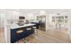 Open concept kitchen with breakfast bar and modern stainless steel appliances at 1410 San Charles Dr, Dunedin, FL 34698