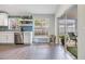 Clean kitchen with white cabinets, stainless steel appliances, and a sliding glass door to the patio at 1419 Trail Boss Ln, Brandon, FL 33511