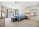 Relaxing main bedroom with a blue bed, a window view of the pool, and neutral carpet at 1419 Trail Boss Ln, Brandon, FL 33511