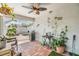Covered patio with brick floors, a grill, plants, and an adjacent pool at 1419 Trail Boss Ln, Brandon, FL 33511