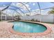 Beautiful pool with brick trim and a screened enclosure for outdoor enjoyment at 1419 Trail Boss Ln, Brandon, FL 33511