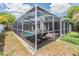 Inviting pool area featuring a screened enclosure and lounge chairs for relaxation at 1419 Trail Boss Ln, Brandon, FL 33511