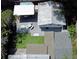 Aerial view of a backyard featuring an in-ground spa, lounge area, and putting green at 1515 E 31St Ave, Tampa, FL 33610