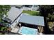 Aerial view of spa with covered lounge and seating area in a private yard at 1515 E 31St Ave, Tampa, FL 33610