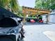 Backyard featuring an outdoor kitchen, covered lounge, and in-ground spa at 1515 E 31St Ave, Tampa, FL 33610